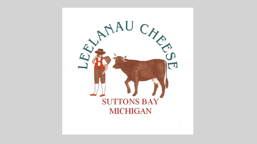 Logo for Leelanau Cheese Company with Swiss styled dairy farmer and his cow.
